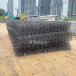 6mm ribbed wire mesh, panel type, 20x20 specification, delivered to a job site in Pathum Thani.